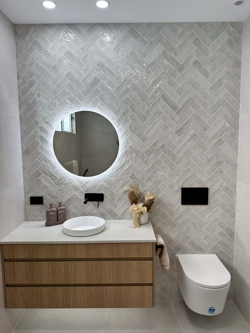 Freestanding bath and wall-hung timber vanity — bathroom remodel by ASP Build & Co
