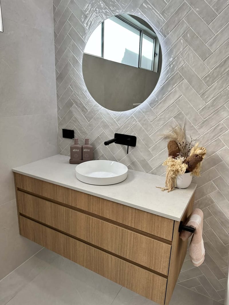 Backlit mirror and custom vanity in a renovated Adelaide bathroom