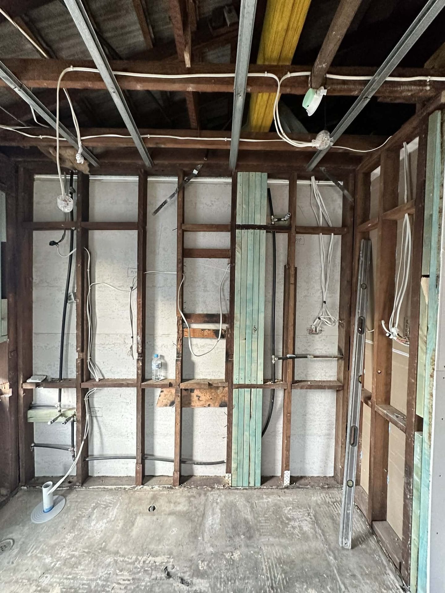 Room stripped back to bare stud framing and wiring during a renovation by ASP Build & Co, Adelaide