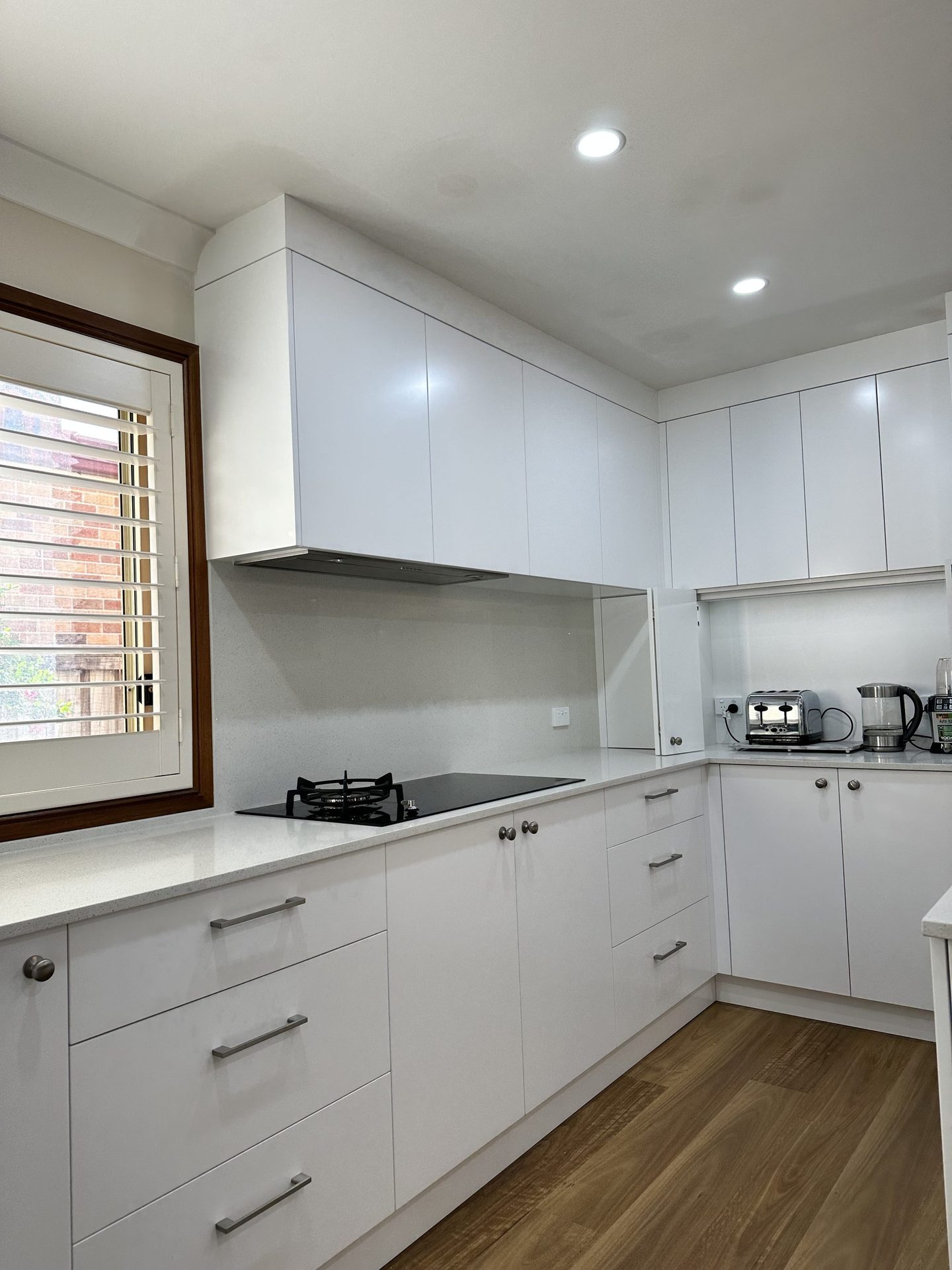 Custom kitchen cabinetry and lighting by ASP Build & Co