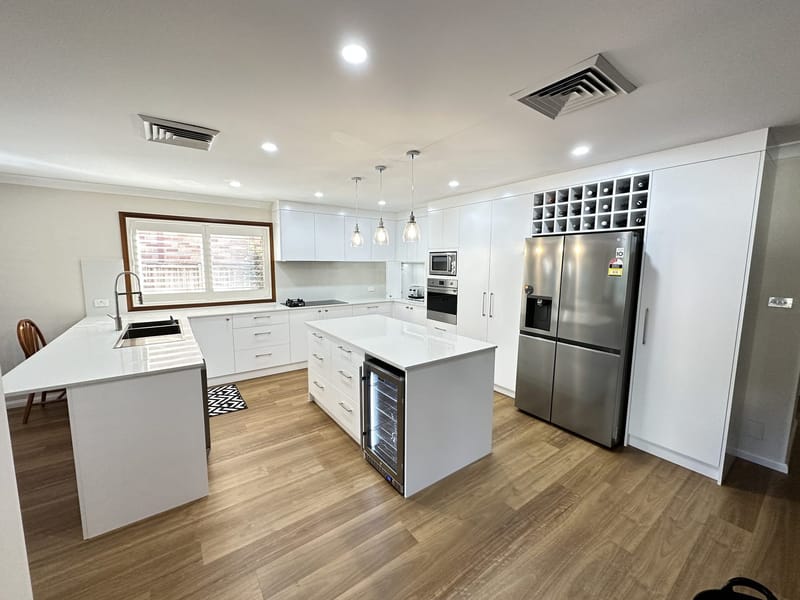 Custom kitchen cabinetry and stone by ASP Build & Co