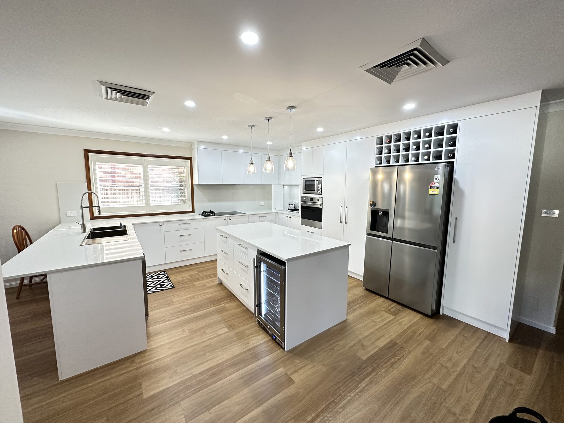 Custom kitchen cabinetry and stone by ASP Build & Co