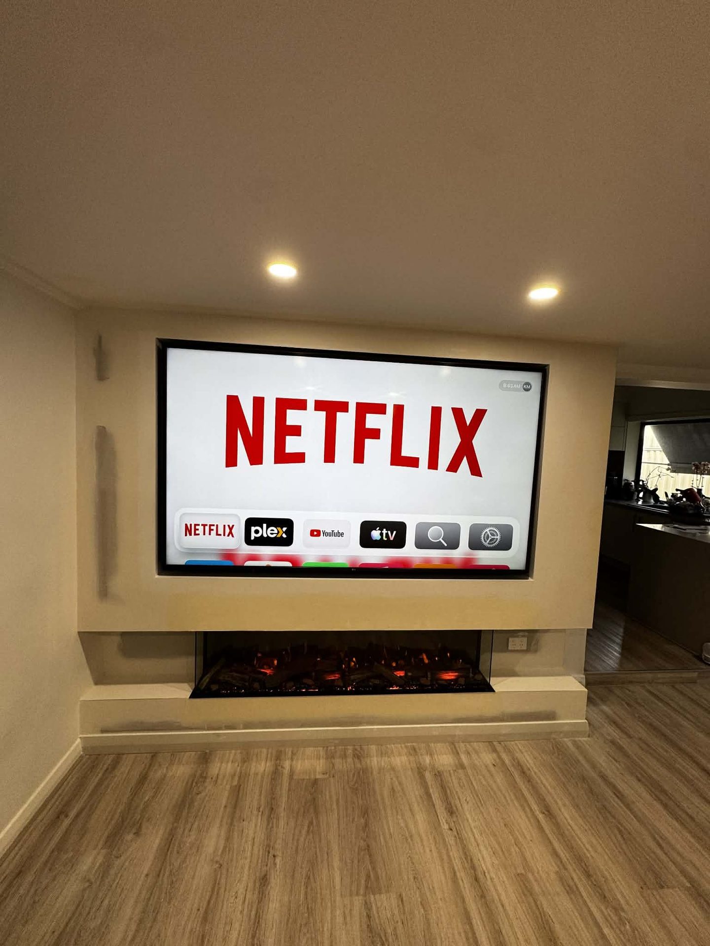 Built-in media wall with integrated fireplace by ASP Build & Co