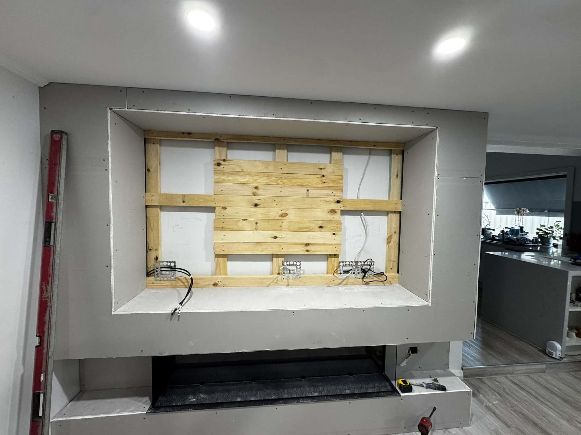 Media wall with integrated fireplace by ASP Build & Co