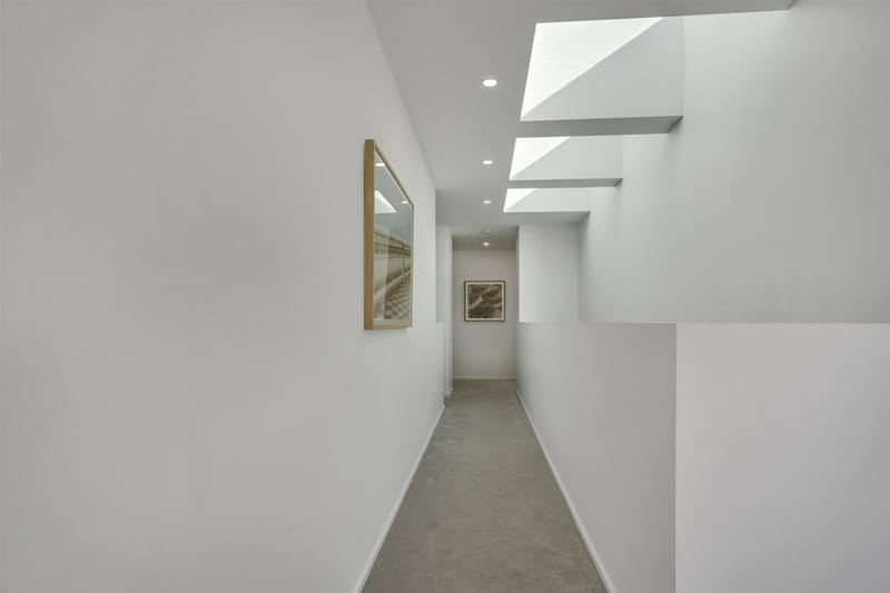 Upstairs hallway with stepped skylights in a Riverlea Park home built by ASP Build & Co