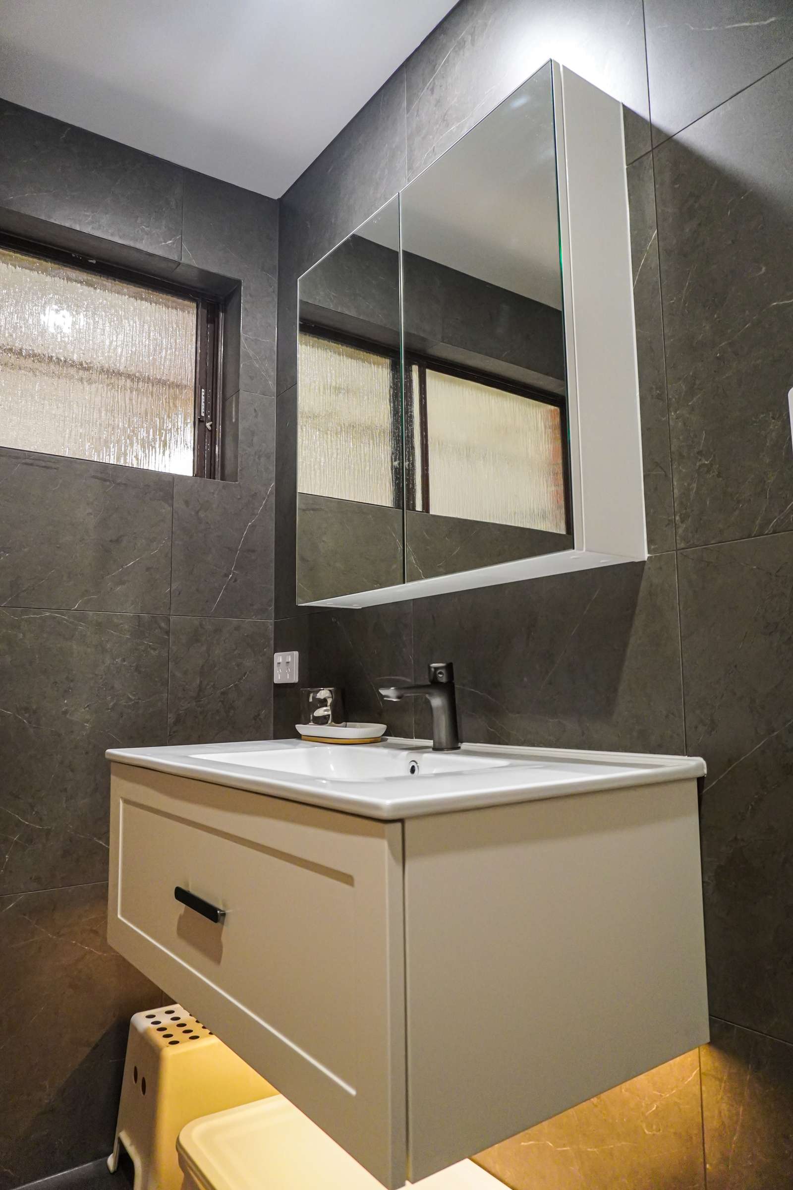 White shaker-style vanity with under-glow, mirror cabinet and black tapware, Modbury bathroom