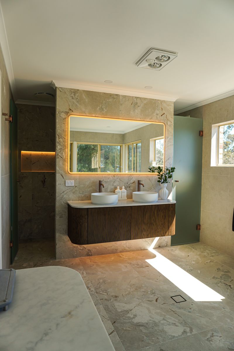 Torrens Park master ensuite with fluted timber floating vanity, double vessel basins and backlit mirror
